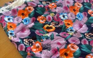 Floral Viscose - Green, lilac and orange print. 85cm length.